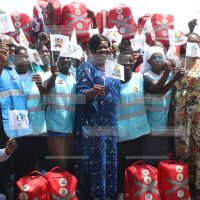 Homa Bay Governor Gladys Wanga pose for a photo with community health promoters