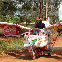 Cyrus Njiru rides a contraption that looks like an airplane