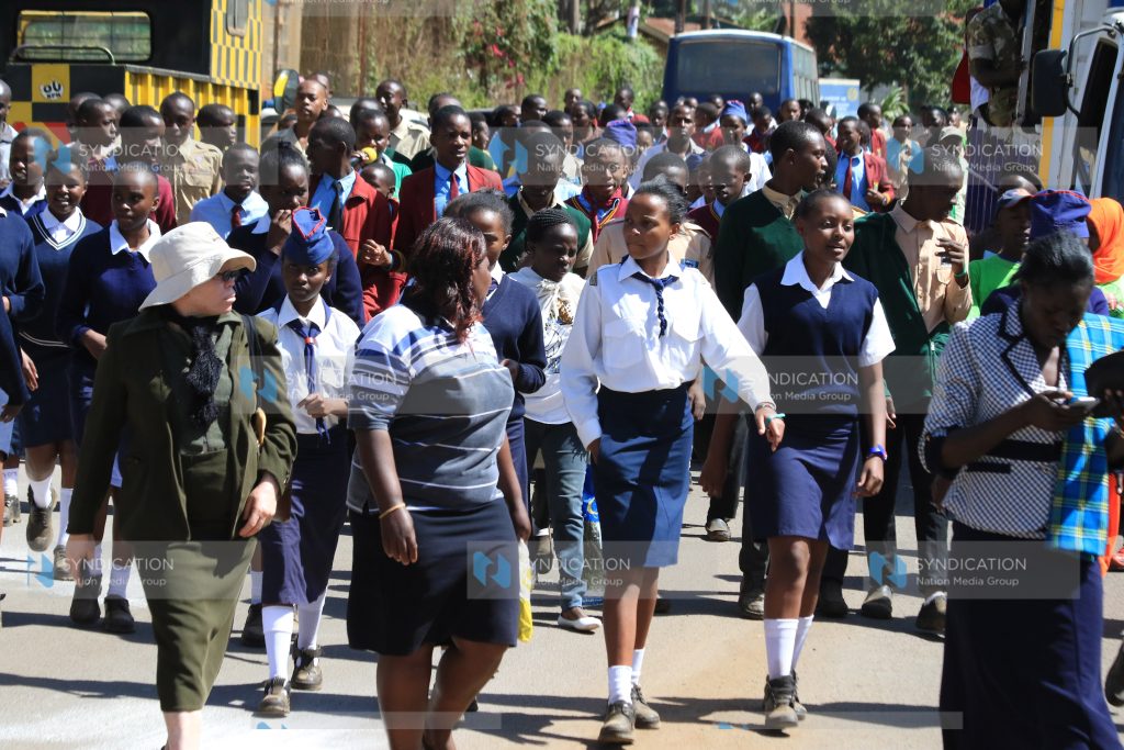 Nyeri residents and students from various schools participate in a peace walk