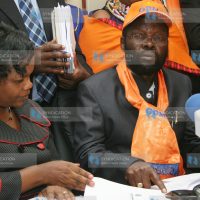 Prof Anyang' Nyong'o (left) after he handed over the party registration documents to the registrar of Political Parties