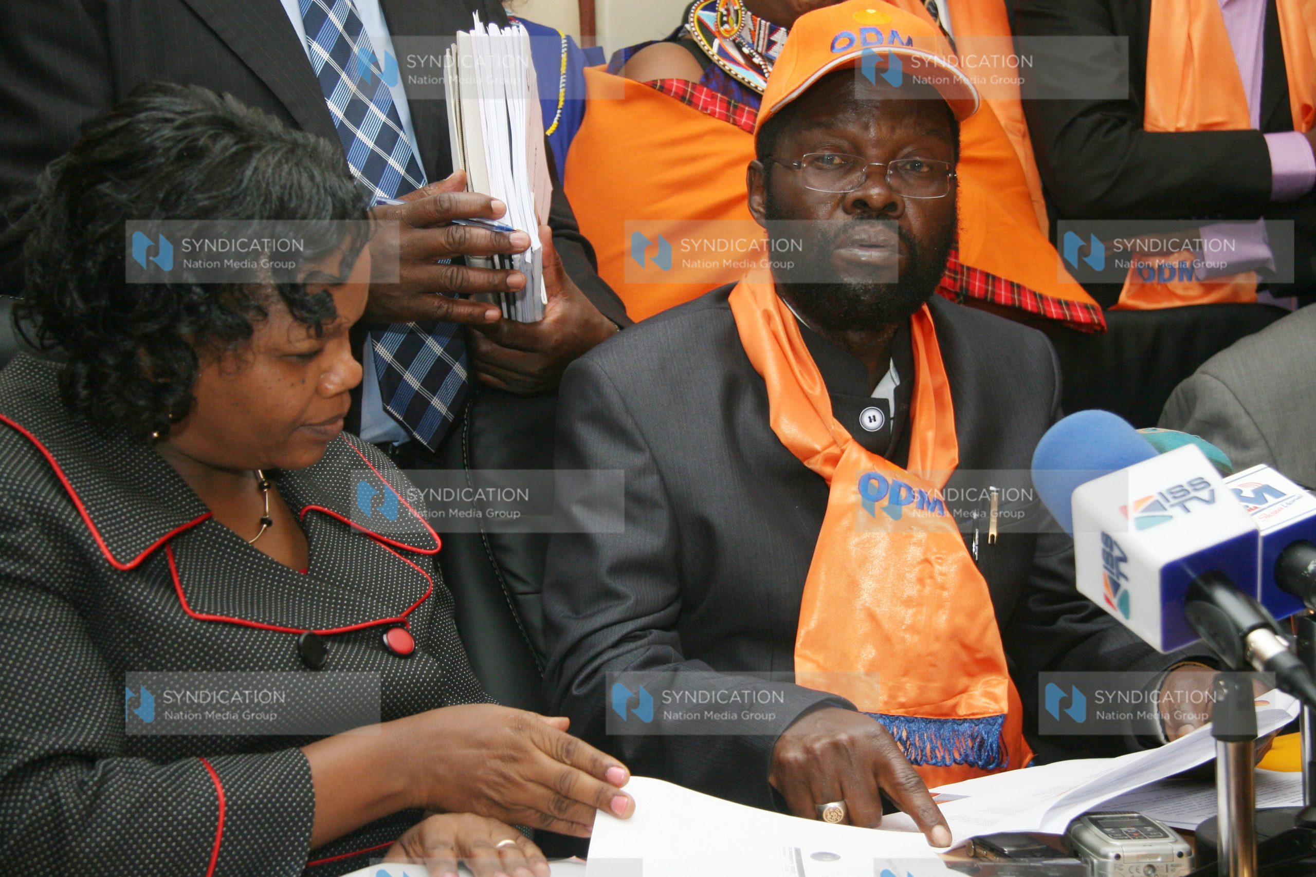 Prof Anyang’ Nyong’o (left) after he handed over the party registration documents to the registrar of Political Parties