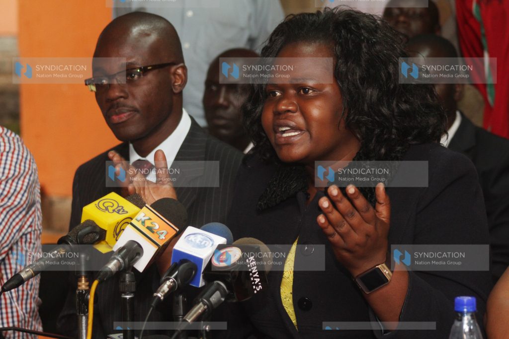 Homabay women rep Gladys Wanga flanked by Moses Kajwang'