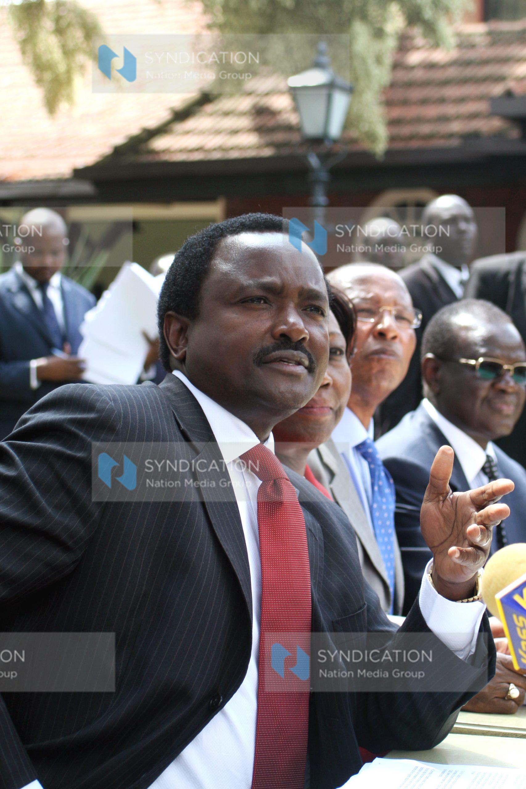 Vice President Kalonzo Musyoka (left) gestures during a press conference