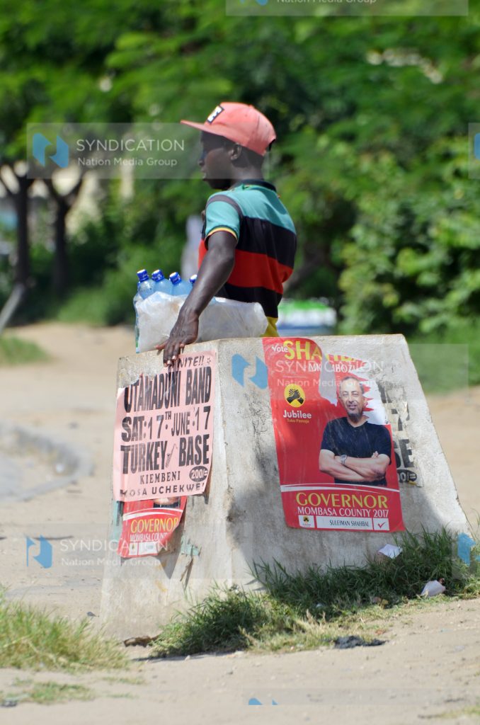 Campaign posters for various political candidates