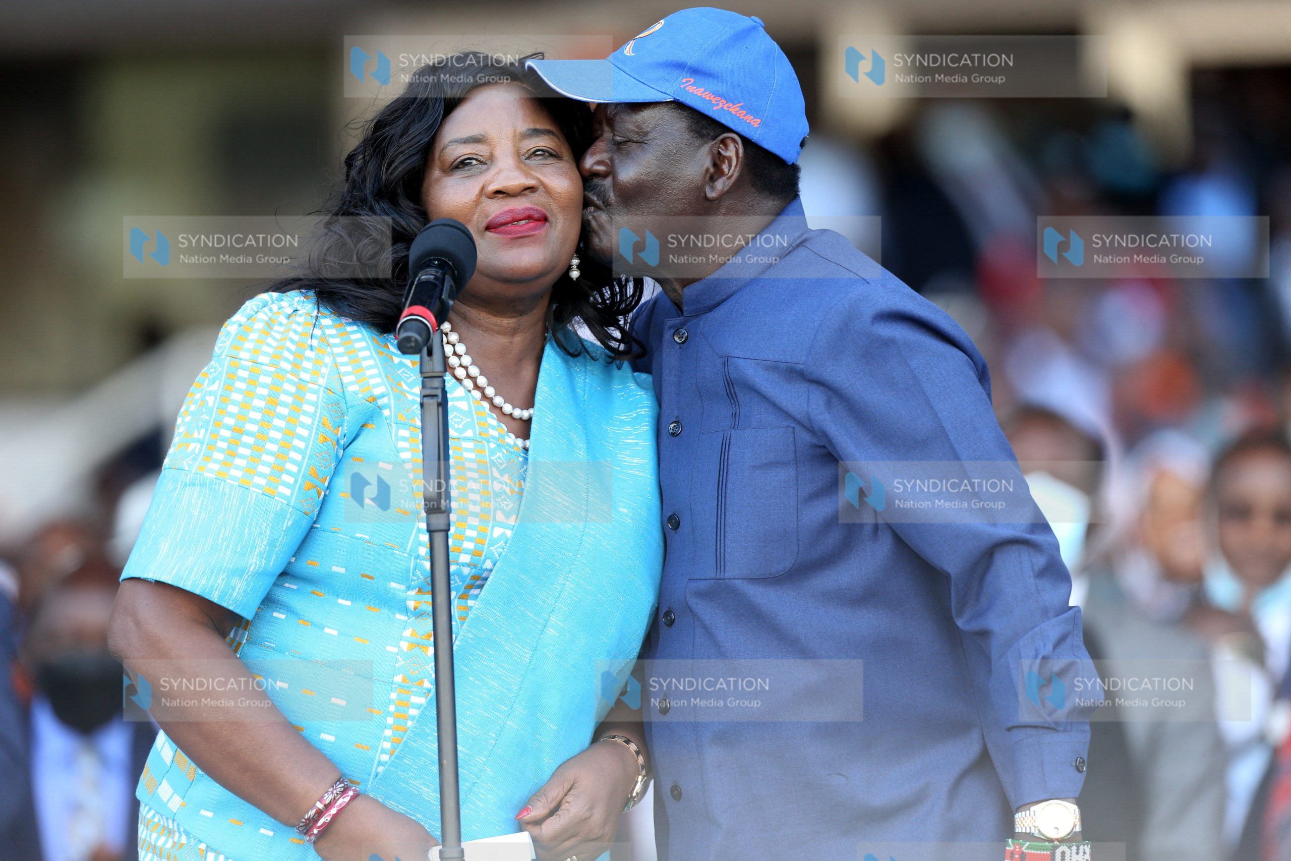 Raila Odinga pecks his wife Ida Odinga