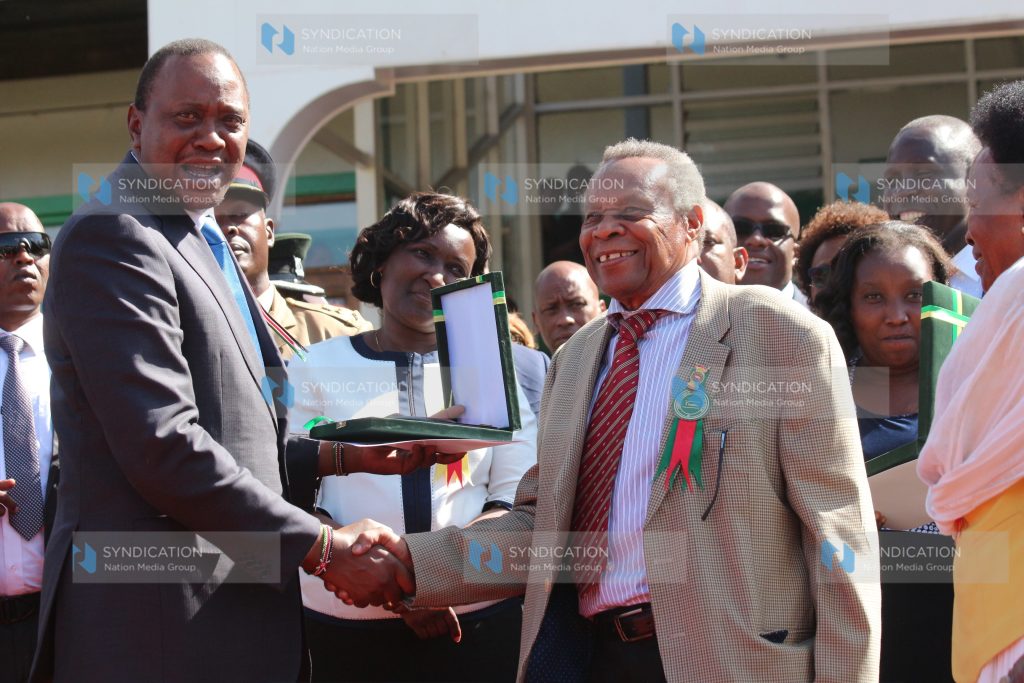 President Uhuru Kenyatta awarding Benson Kaaria with the prestigious 50 years Agriculture Society of Kenya Lifetime Award