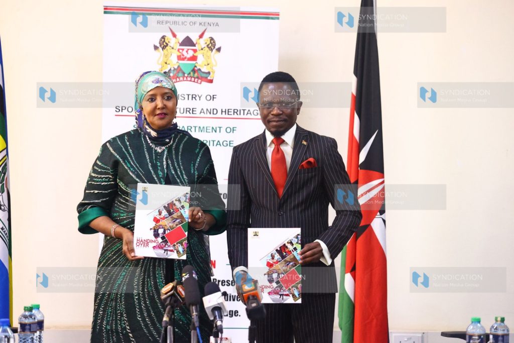 Outgoing CS Amina Mohamed with Incoming Sports CS Ababu Namwamba