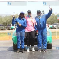 Maxine Wahome and navigator Murage Waigwa pose for a photo with Sports CS Amina Mohamed