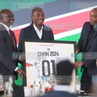 President William Ruto receives a signed Team Jersey from Captain Abud Omar and coach Benni McCarthy