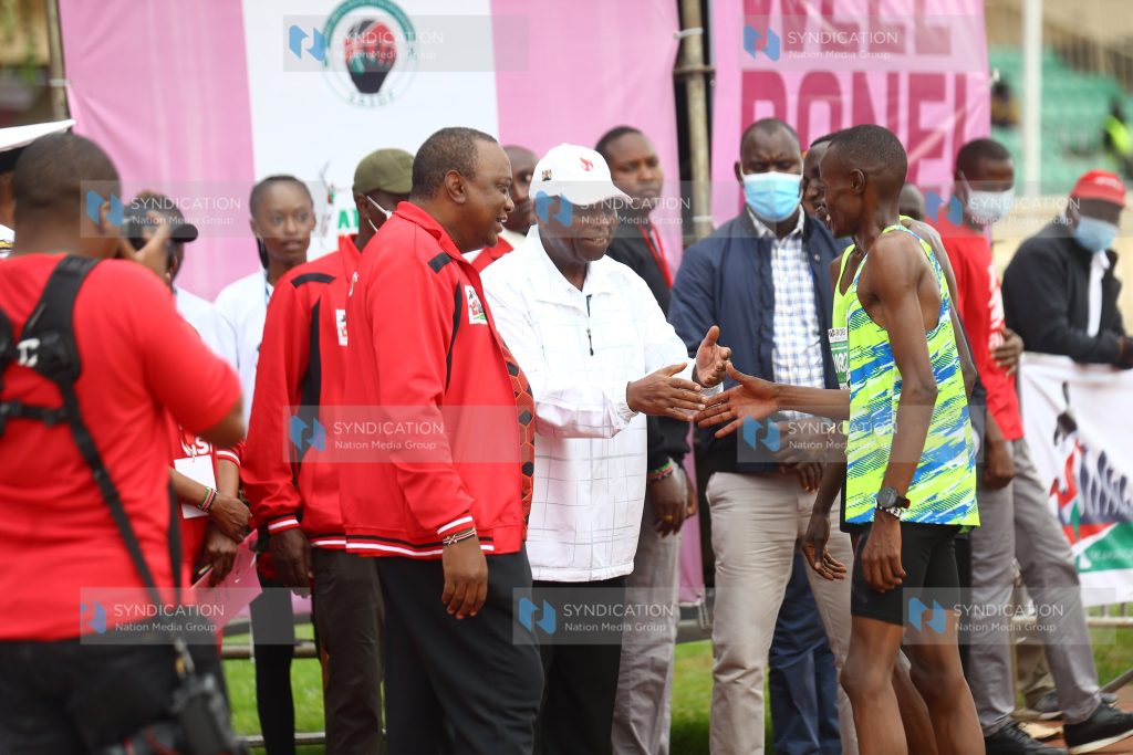 President Uhuru Kenyatta congratulates athletes
