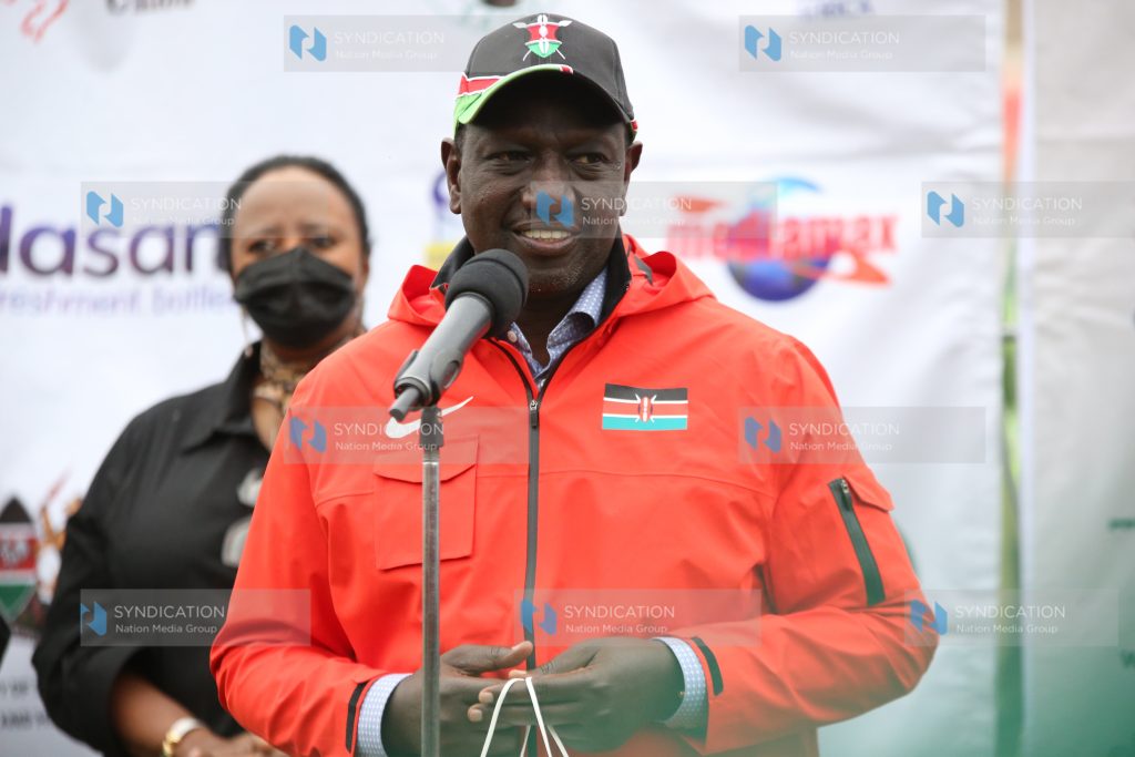 Deputy President William Ruto and Sports CS Amina Mohamed talk to Kenya Rugby team