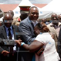 Ms. Lucy Njoki wa Kioi when she hugged President Uhuru Kenyatta