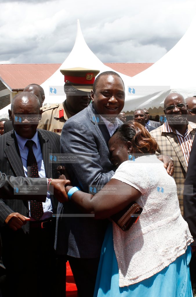 Ms. Lucy Njoki wa Kioi when she hugged President Uhuru Kenyatta
