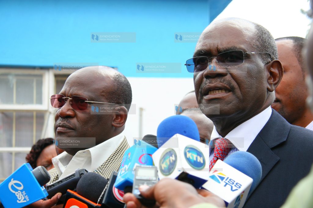 David Musila (right), flanked by Johnson Muthama, addresses a press conference