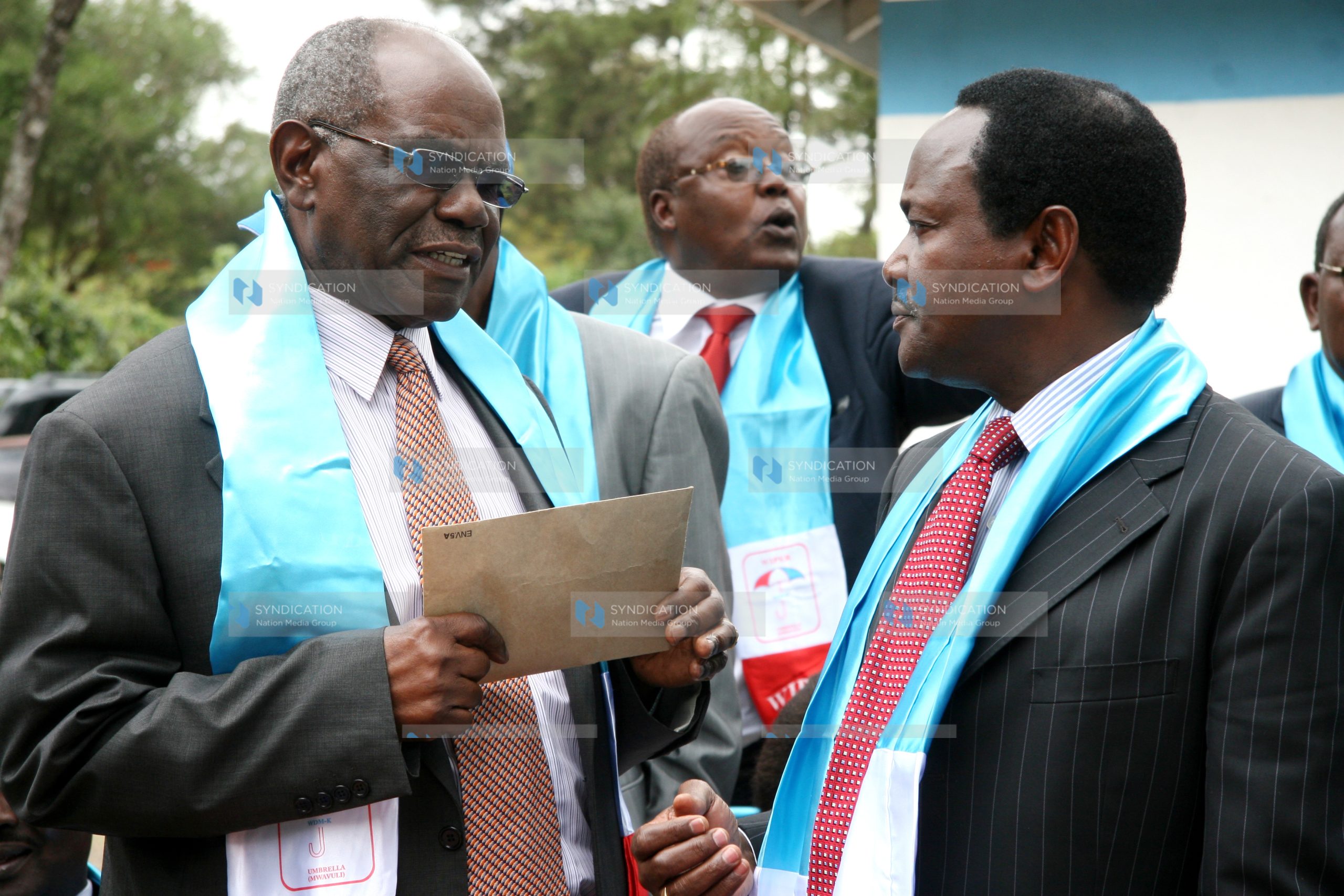 Kalonzo Musyoka (right) with the party chair David Musila(left)