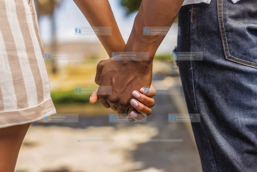 Close up outdoor protrait of black african american couple holding hands