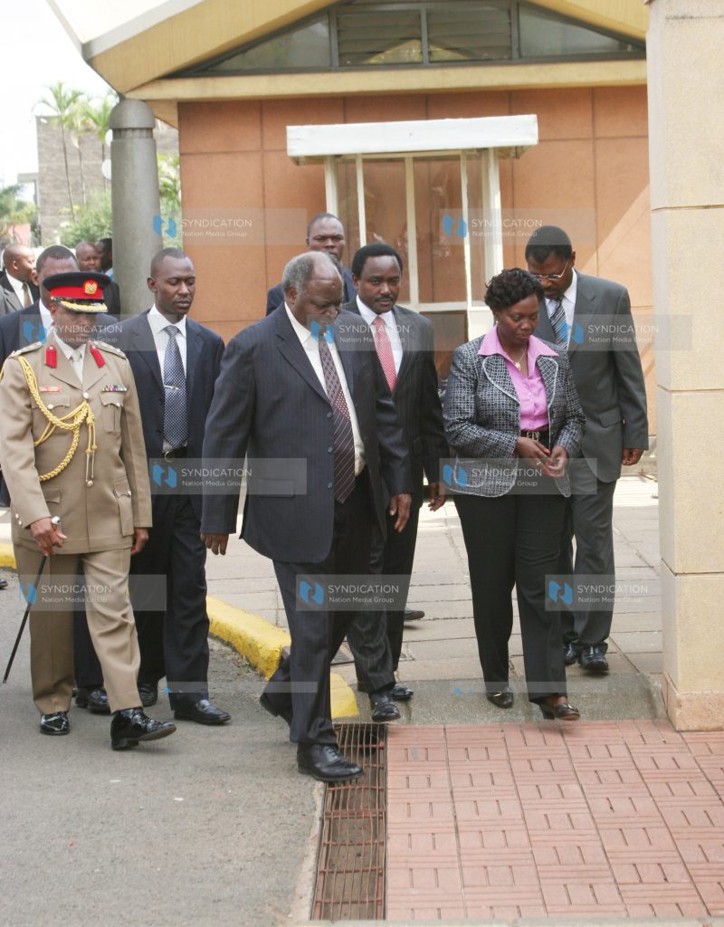 President Mwai Kibaki (left) is welcomed by his Vice Mr. Kalonzo Musyoka
