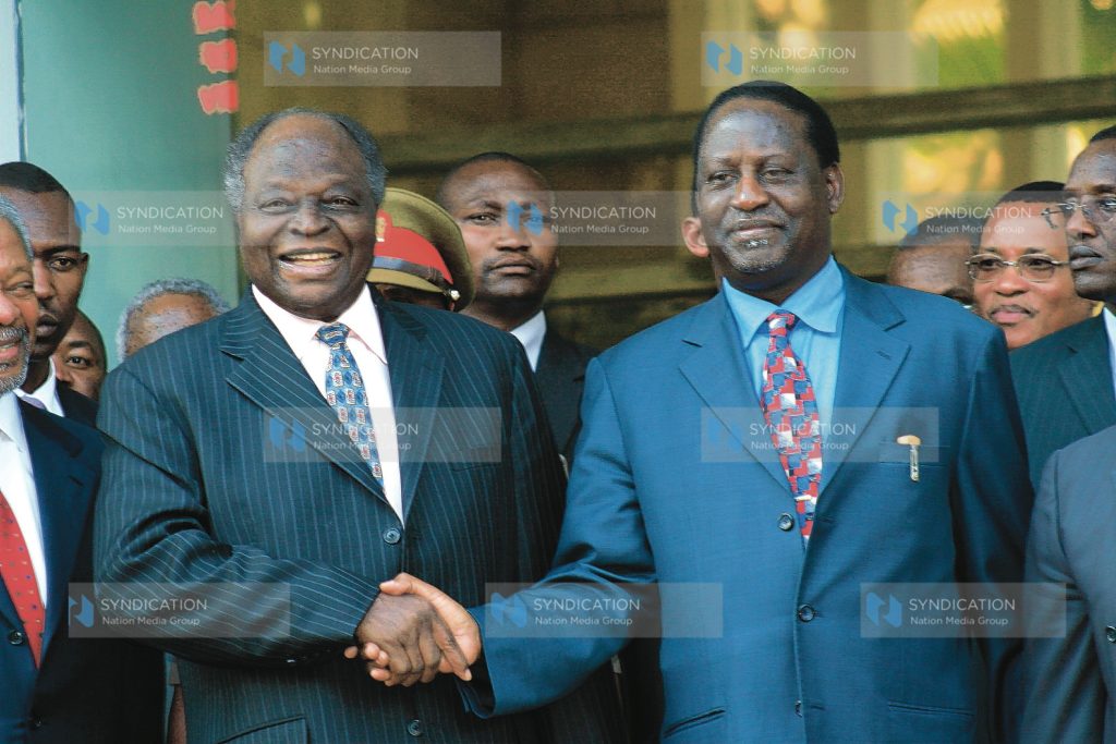 President Mwai Kibaki, shakes hands with ODM Raila Odinga
