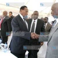 Former President Daniel Arap Moi shakes hands with Internal Security Minister Prof George Saitoti