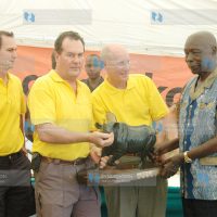 Former President Daniel Arap Moi (right) hands over trophies to the 2009 Rhino Charge Car No. 5 team winners
