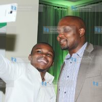 Churchil live comedian Chipukizeey taking a selfie with Hon Moses Kuria of Gatundu south