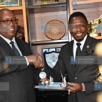 Ababu Namwamba (right) receiving a token of appreciation from Stephen Gitagama