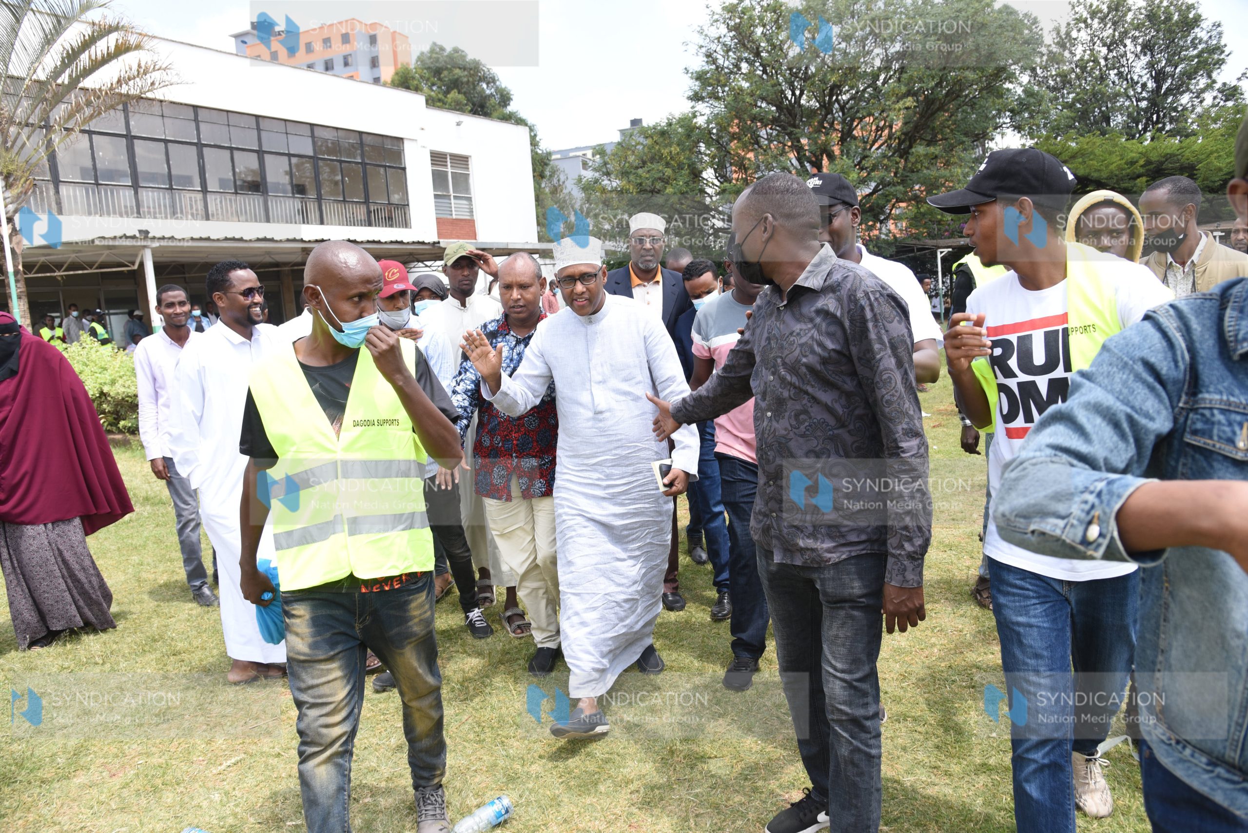 Former East African Community and Regional Development Cabinet Secretary Adan Mohamed (centre)