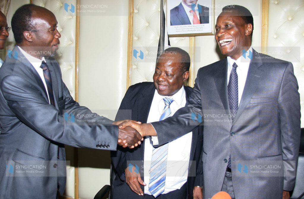 Education Cabinet Secretary Prof. Jacob Kaimenyi (Right) congratulated by Egerton University Vice Chancellor