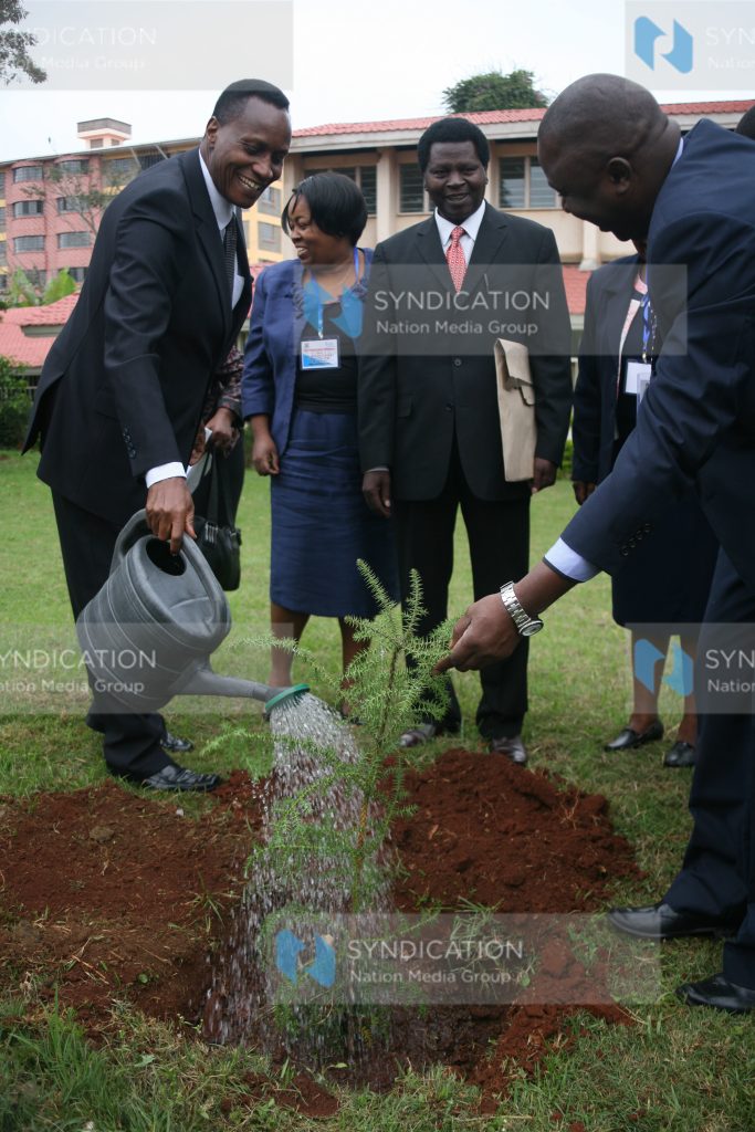Education cabinet secretary Prof Jacob Kaimenyi waters a tree