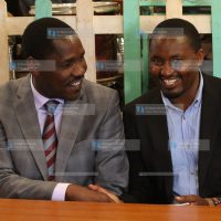 Mwangi Kiunjuri (right) shakes hands with Meru Governor Peter Munya