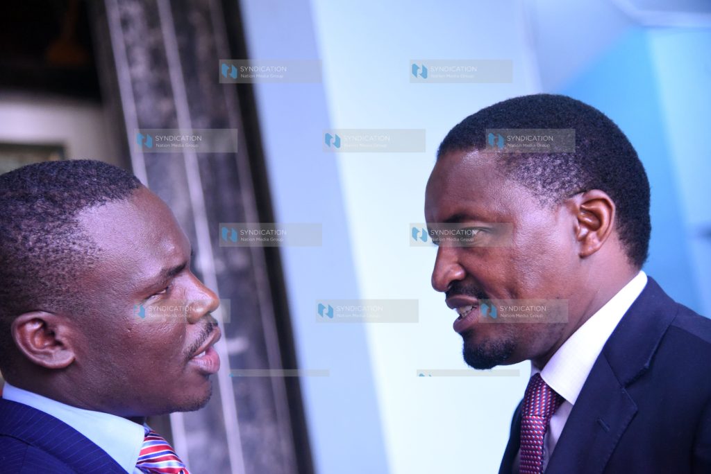 Mwangi Kiunjuri with South Mugirango MP Sylvanus Osoro (L)