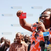 Women Rep Gladys Wanga shows a red card to a section of ODM MPs who have gone against the party