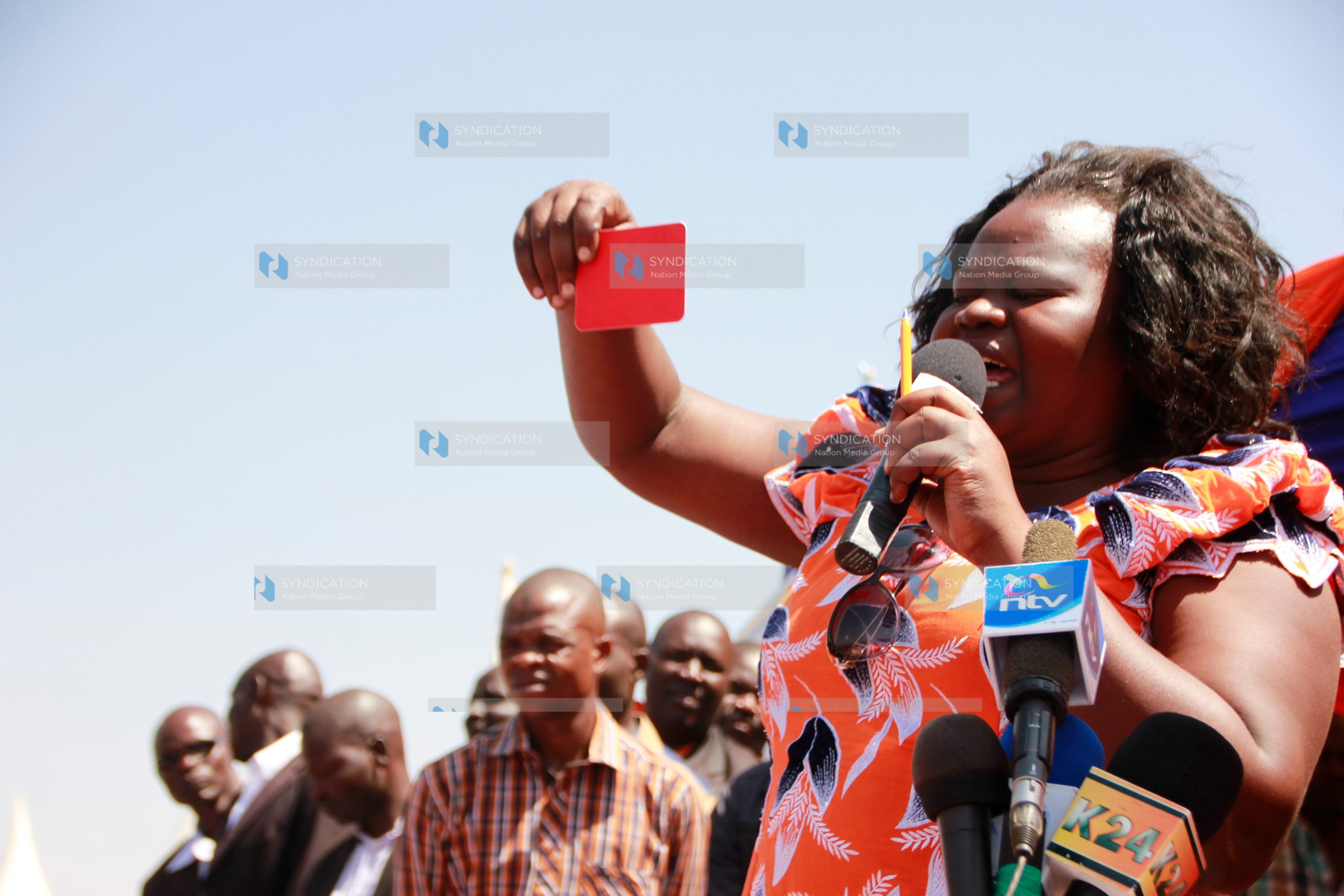 Women Rep Gladys Wanga shows a red card to a section of ODM MPs who have gone against the party