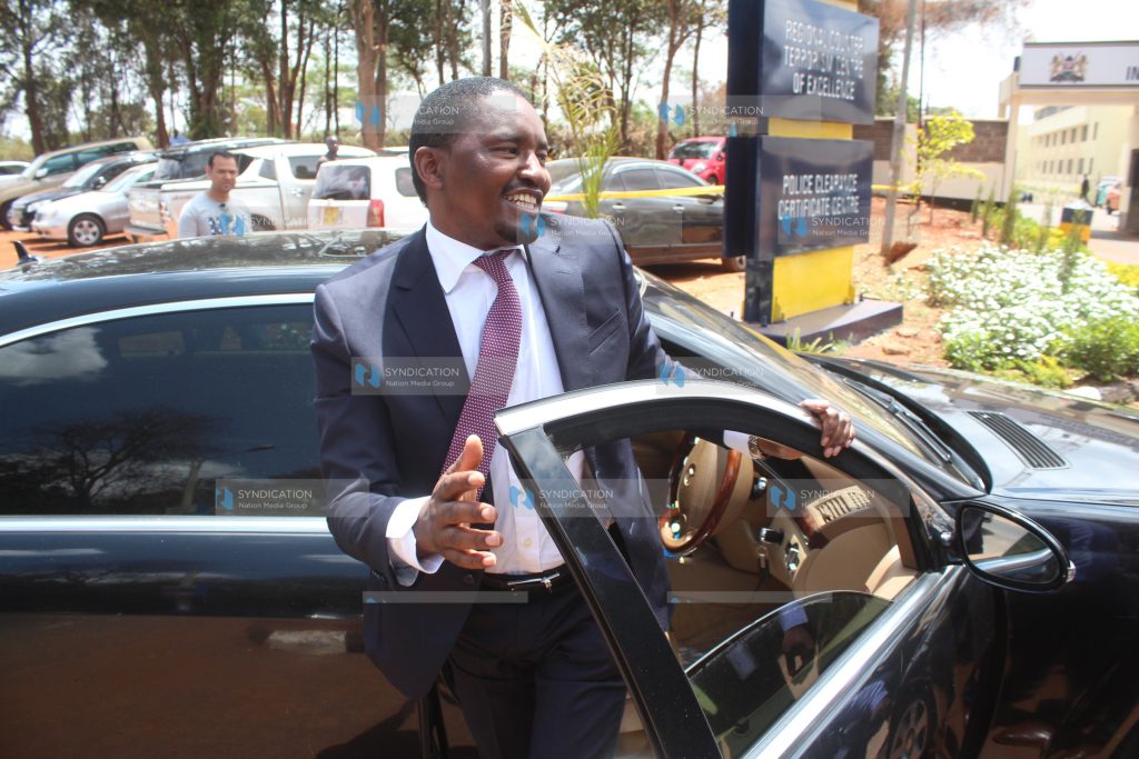Agriculture Mwangi Kiunjuri getting out of his car