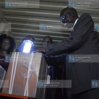 PS Education Belio Kipsang’ oversees the distribution of examination papers