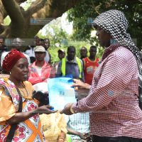 Kisumu Senator Tom Ojienda (R) receives a petition from Mama Fatuma Hamisi
