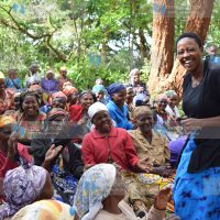 Murang'a Woman Rep Sabina Chege shares a light moment with elderly women