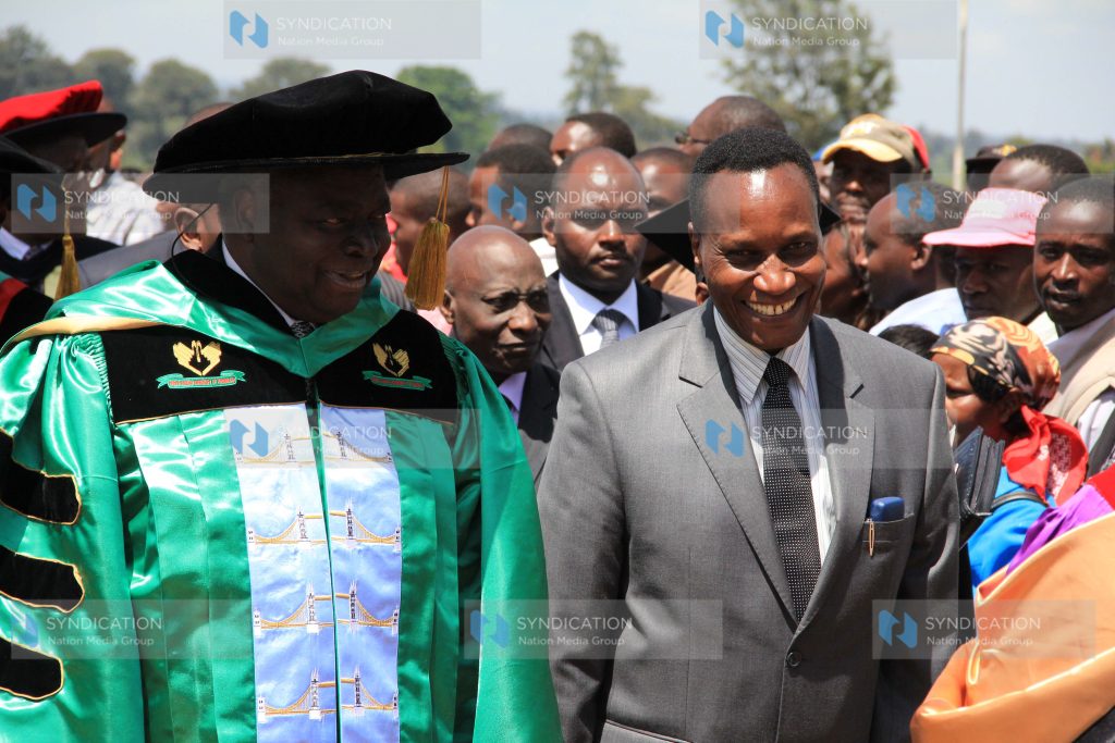 Former President Mwai Kibaki, left, is accompanied by Education Cabinet Secretary Prof Jacob Kaimenyi