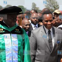 Former President Mwai Kibaki, left, is accompanied by Education Cabinet Secretary Prof Jacob Kaimenyi