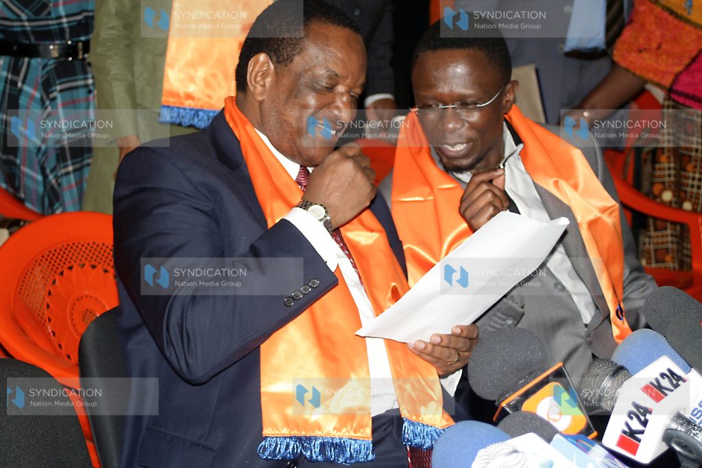 Minister for Cooperative Development Joe Nyaga has a word with MP Ababu Namwamba