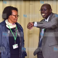 KNEC Acting Chief Executive Officer Dr. Mercy Karogo confers with Ministry of Education, Principal Secretary of Basic Education Dr. Belio KIpsang
