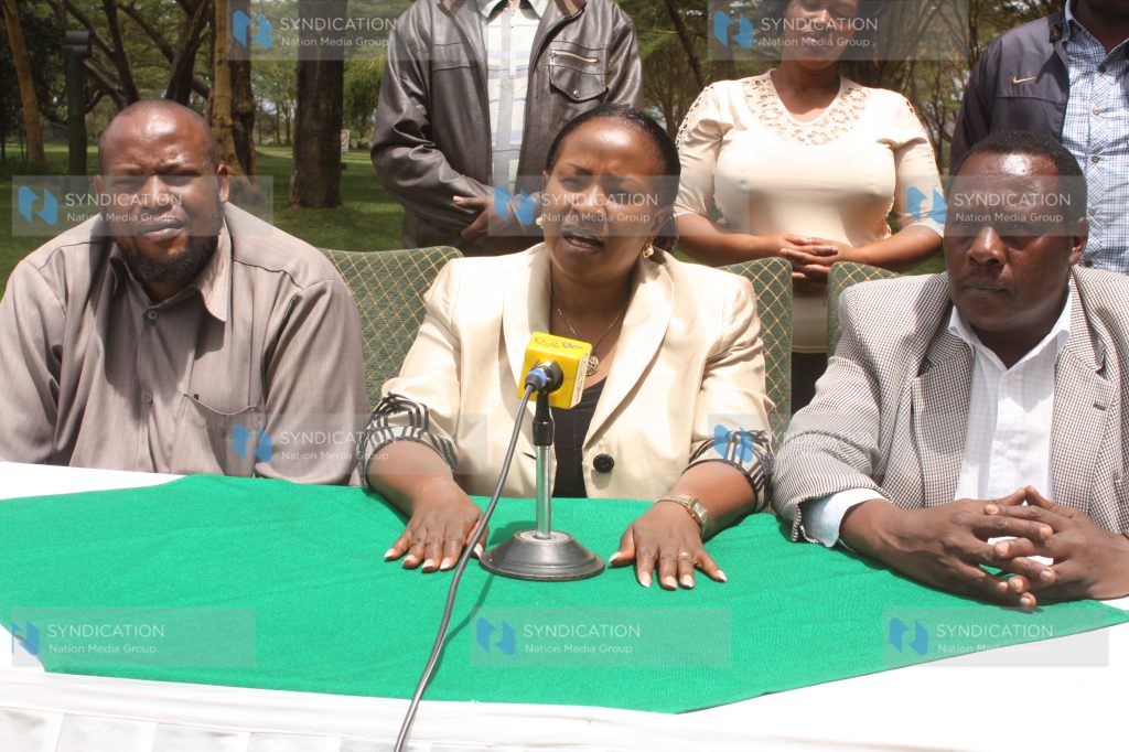 Wavinya Ndeti (middle) flanked by officials speaks to journalists