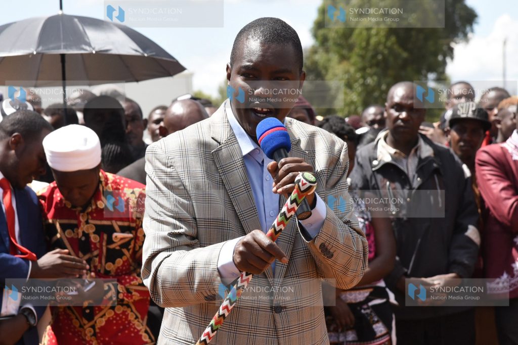 Jackson Mandago addresses mourners during a burial of the late Peter Mwaura Kungu