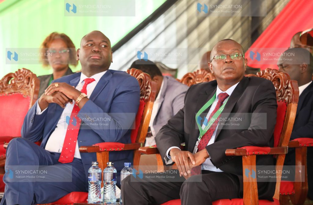 Basic Education Principal Secretary Julius Bitok and KNEC CEO David Njengere