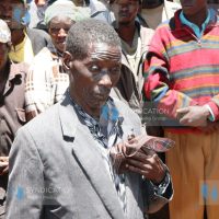 Joseph Mwangi Macharia, 72, in a somber mood during the exhumation of seven bodies of his family members who were killed during post-election violence