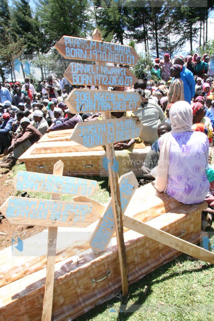 Coffins which were used for the burial of seven bodies of people from one family who were killed during post-election violence