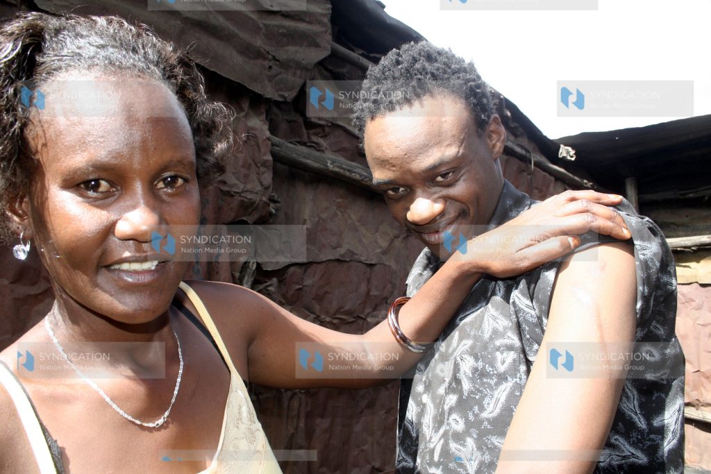 Nancy Gachie shows the press the hand of her husband George Gachie who was sliced by panga during the post-election violence