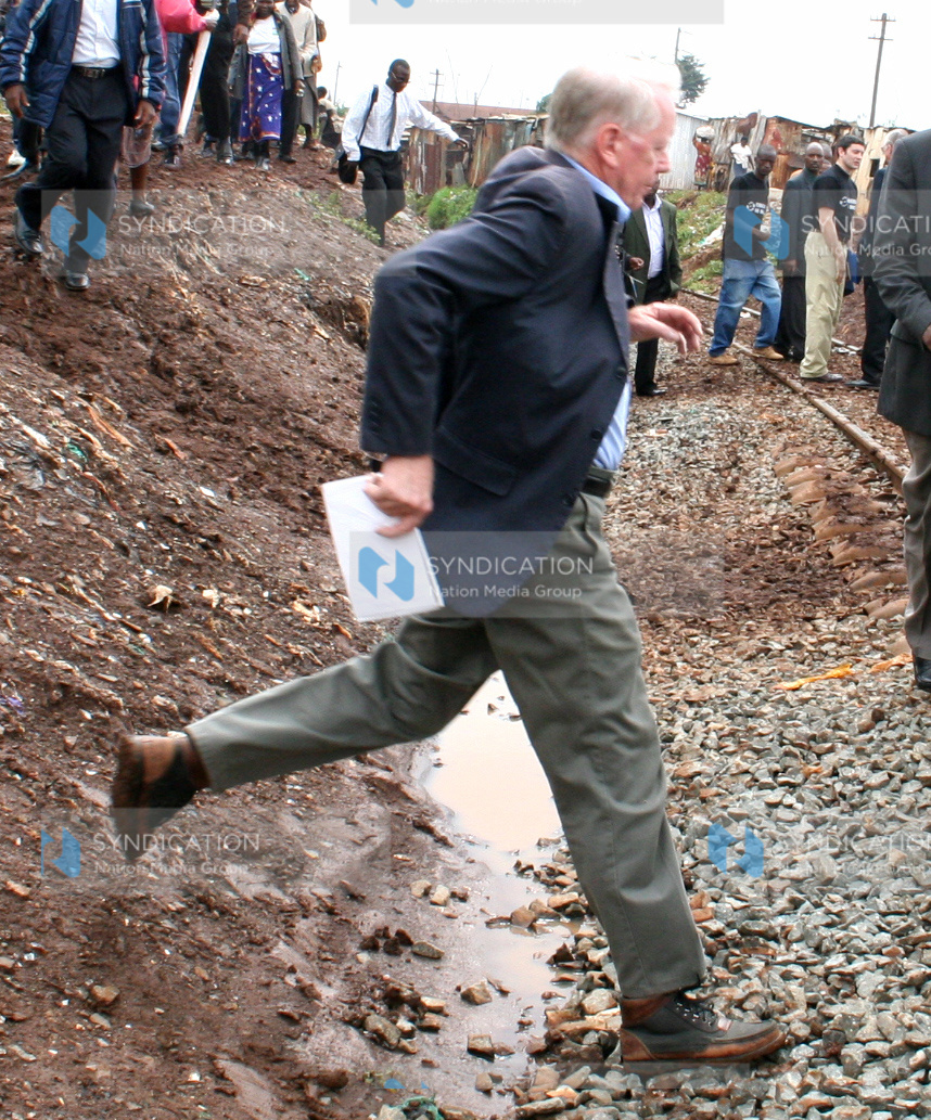 US ambassador to Kenya Michael Ranneberger jumps across a ditch when he visited post-election violence victims
