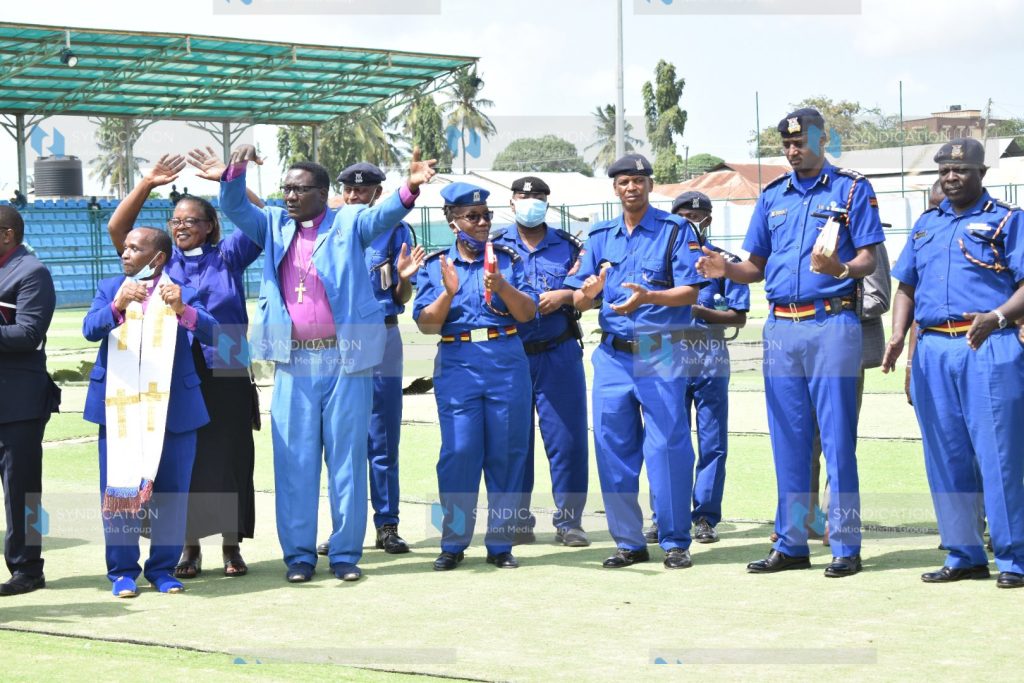 Police officers and members of the clergy in Changamwe, Mombasa County