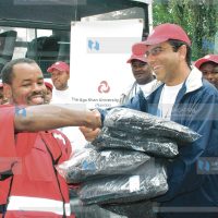 Chief Operating manager The Aga Khan University hospital Moyez Jadavji presents blankets to Red Cross official